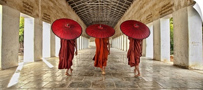 Monks walking to their monastery in Bagan, Burma