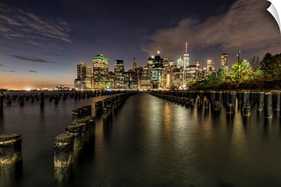 Old pier pylons and Downtown Manhattan, New York City