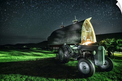 Old tractor and red barn after dark in the Palouse, Washington