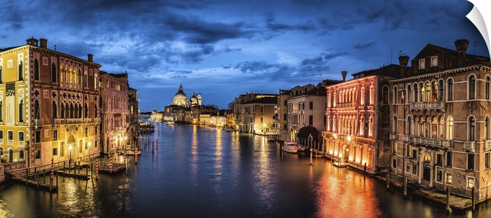 Panorama from the Academia Bridge after dark in Venice, Italy.