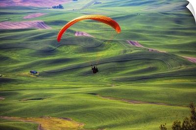 Paraglider above green the wheat fields in the Palouse region of Washington