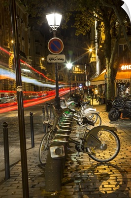 Paris street with car trails at night