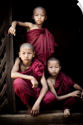 Portrait of three young monks in their monastery, Bagan, Burma