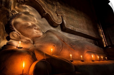 Reclining BUddha with candles in Bagan, Burma