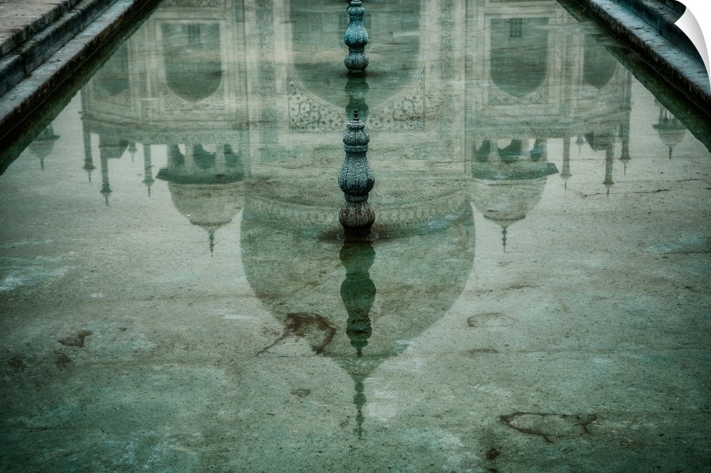 Reflection of the Taj Mahal in one of the pools.