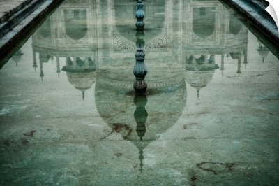 Reflection of the Taj Mahal in one of the pools