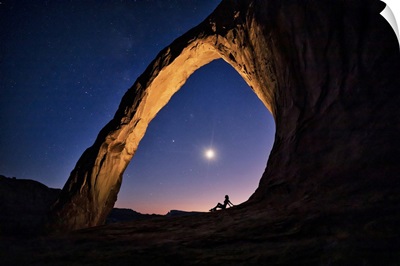 Silhouette Of A Woman Under Corona Arch In Moab, Utah