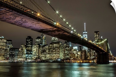 The Brooklyn Bridge and view of NYC after dark