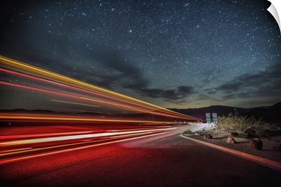 Truck light trails at night in Death Valley National Park