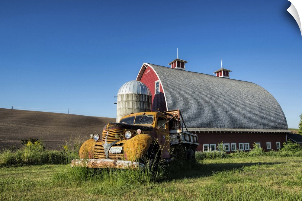 Vintage pickup truck and red barn in the Palouse region of Washington State