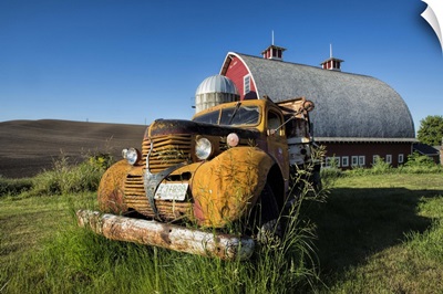 Vintage pickup truck and red barn in the Palouse region of Washington