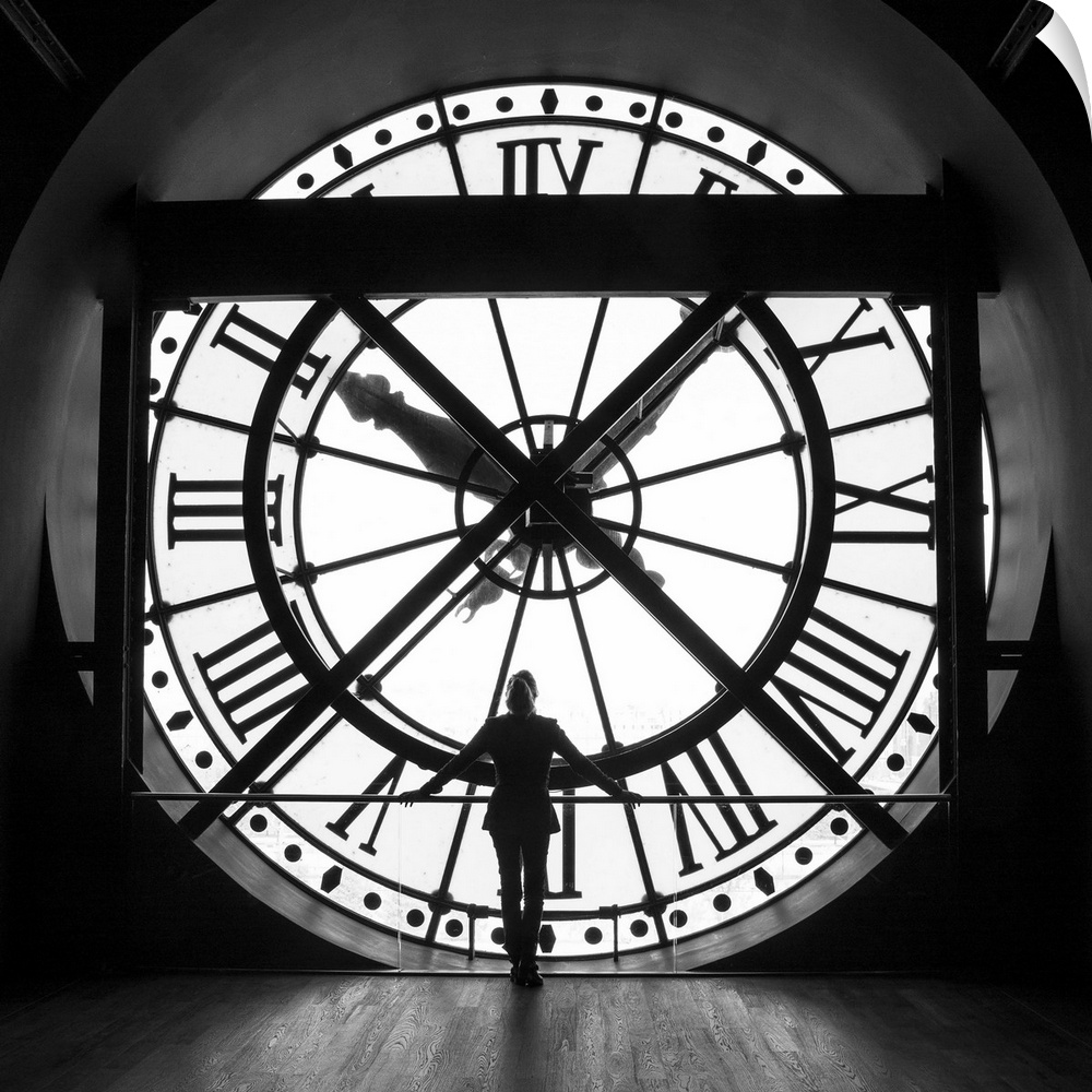 Woman by the clock inside the Musee D'Orsay in Paris