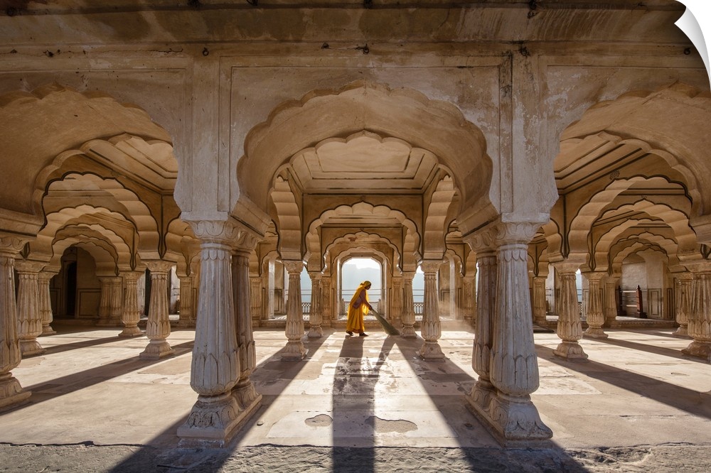 Woman sweeping in the Amber Fort in Jaipur, India.