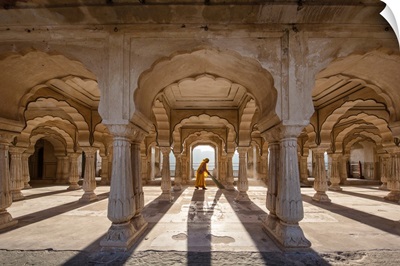 Woman sweeping in the Amber Fort in Jaipur, India