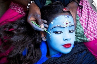 Young Girl Having Her Face Painted In Varinasi, India