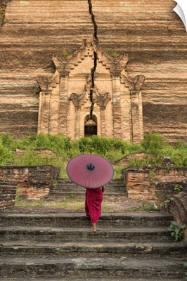 Young monk walking up Mingun Temple in Mandalay, Burma