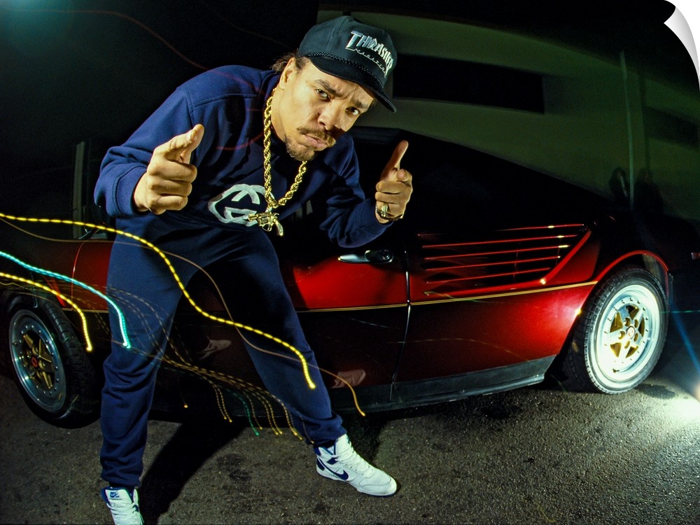 Rapper Ice-T posing with a cherry red car and light trail effects, Los Angeles, 1988.
