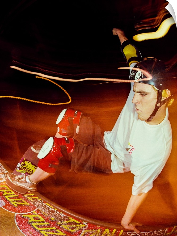 Jeff Grosso skateboarding on a railing with light trails, 1988.