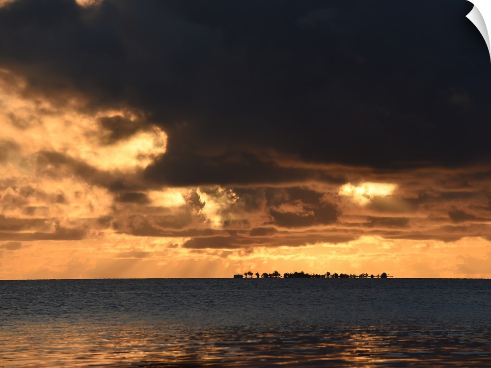 Dark storm clouds over the ocean in Belize at sunset, Caribbean.