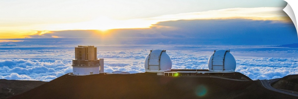 Big Island Hawaii. The sun sets over the observatories on Mauna Kea.