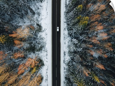 Aerial View Of Snow Covered Trees And Winter Country Road With A Car