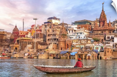 Ancient Varanasi City At Sunset With Sadhu Baba Enjoying A Boat Ride On The River Ganges