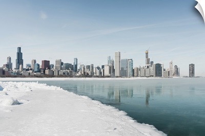 Chicago Downtown Panorama In Winter, Frozen Lake With Snow Covers Lake Michigan
