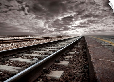 Empty Railroad Tracks With Stormclouds