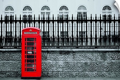 Red telephone box in street, London