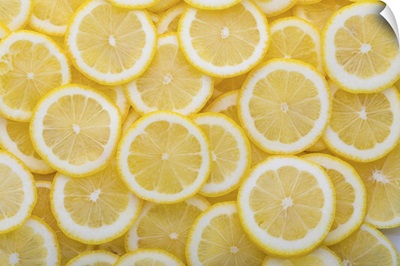 Yellow Sliced Lemons Places On A Table Overlapping Each Other
