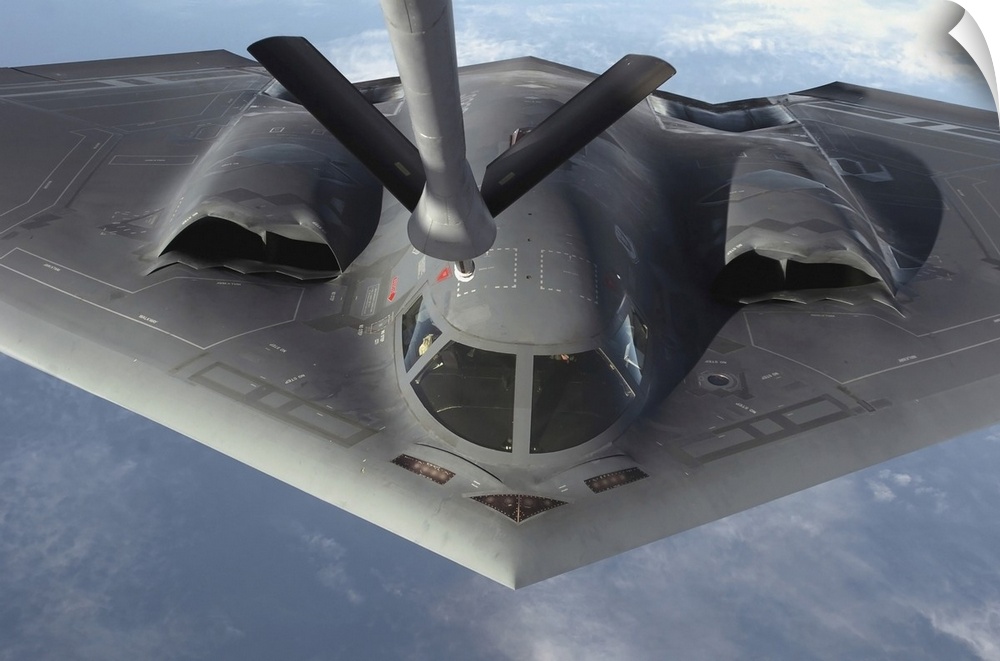 Over the Pacific Ocean - A B-2 Spirit bomber prepares to refuel from a KC-135 Stratotanker during a deployment to Andersen...