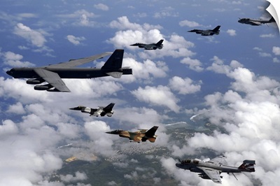A B52 Stratofortress leads a formation of aircraft over Guam