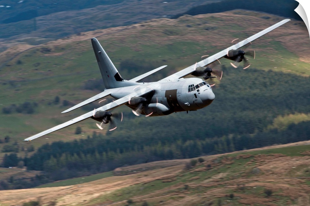 A C-130 Hercules of the Royal Air Force flying over North Wales, United Kingdom.