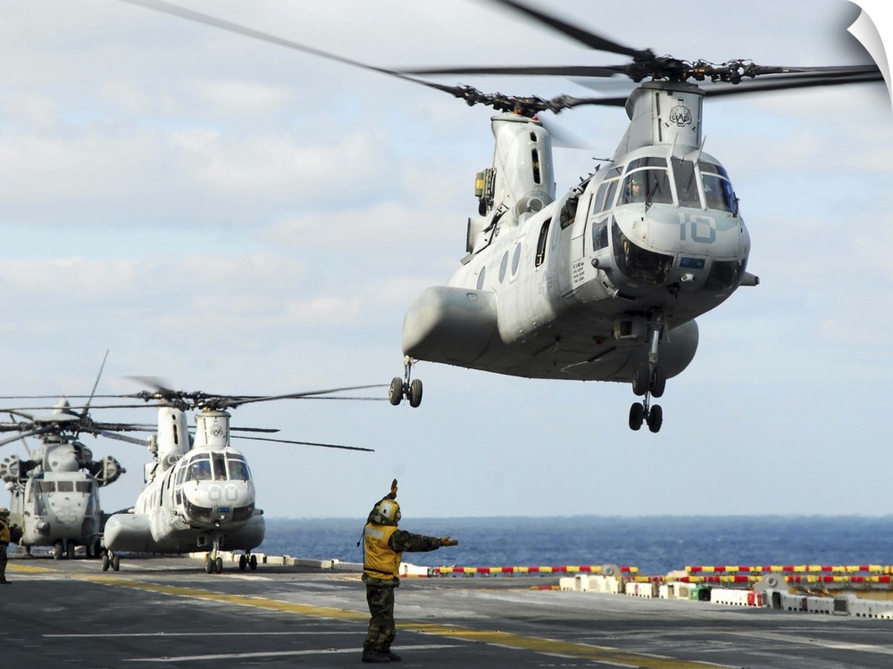 Sea of Japan, March 18, 2011 - A CH-46E Sea Knight helicopter takes off from the flight deck of the forward-deployed amphi...