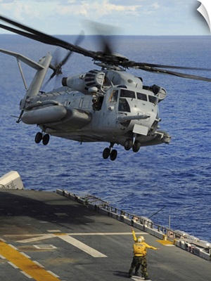A CH 53E Sea Stallion helicopter takes off from amphibious assault ship USS Essex