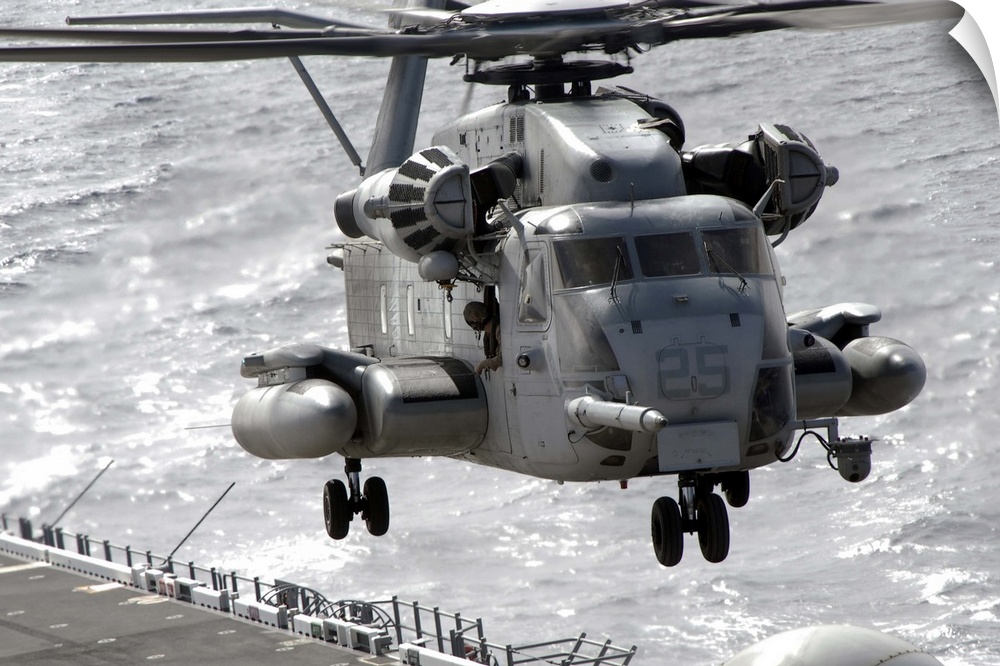 A CH53E Super Stallion helicopter takes off from USS Makin Island