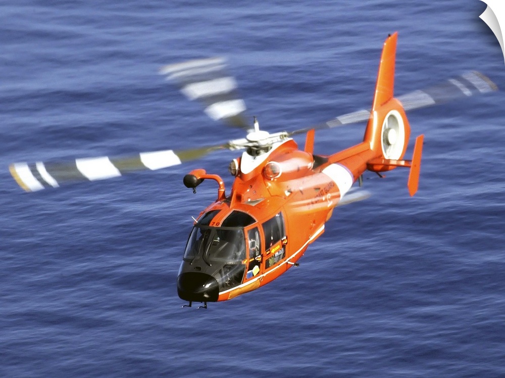 U.S. Coast Guard Air Station Barbers Point, Hawaii, December 20, 2002 - A Coast Guard HH-65A Dolphin rescue helicopter per...