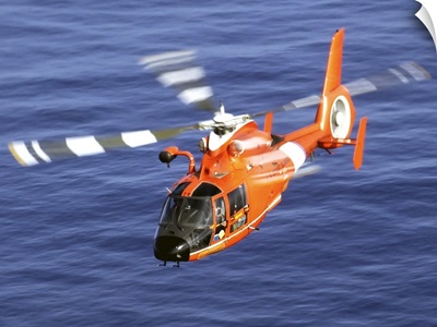 A Coast Guard HH 65A Dolphin rescue helicopter in flight