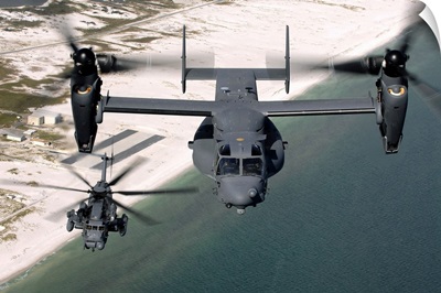 A CV22 Osprey and an MH53 Pave Low fly over the coastline of Florida