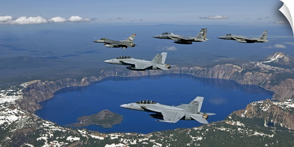 A five ship formation of two F-15 Eagles, two F-18 Super Hornets and an F-16 Fighting Falcon fly over Crater Lake, Oregon,...