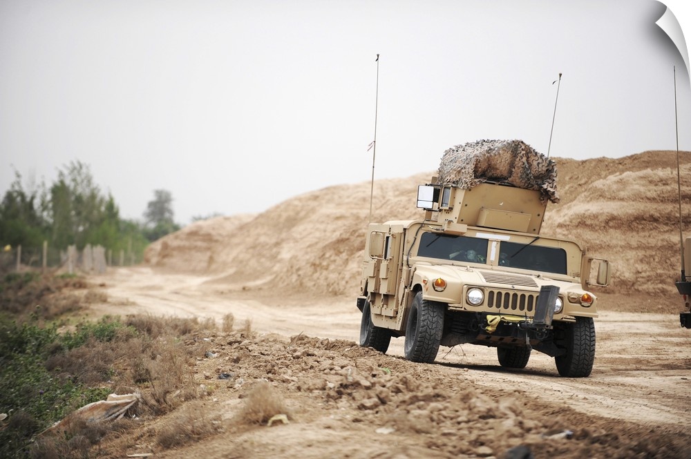 A Humvee conducts security during a patrol in the Iraqi village of Bakr.