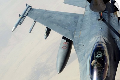A KC135 Stratotanker refueling an F16CJ Fighting Falcon over Iraq