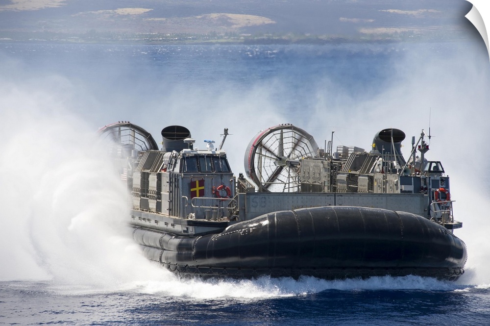 Pacific Ocean, July 23, 2014 - A landing craft air cushion prepares to embark the well deck of the amphibious dock landing...