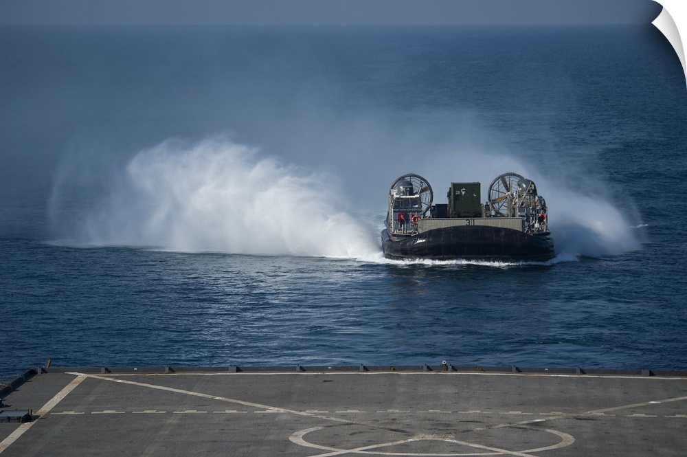 Arabian Gulf, December 10, 2014 - A Landing Craft Air Cushion makes its approach to the well deck of the amphibious dock l...