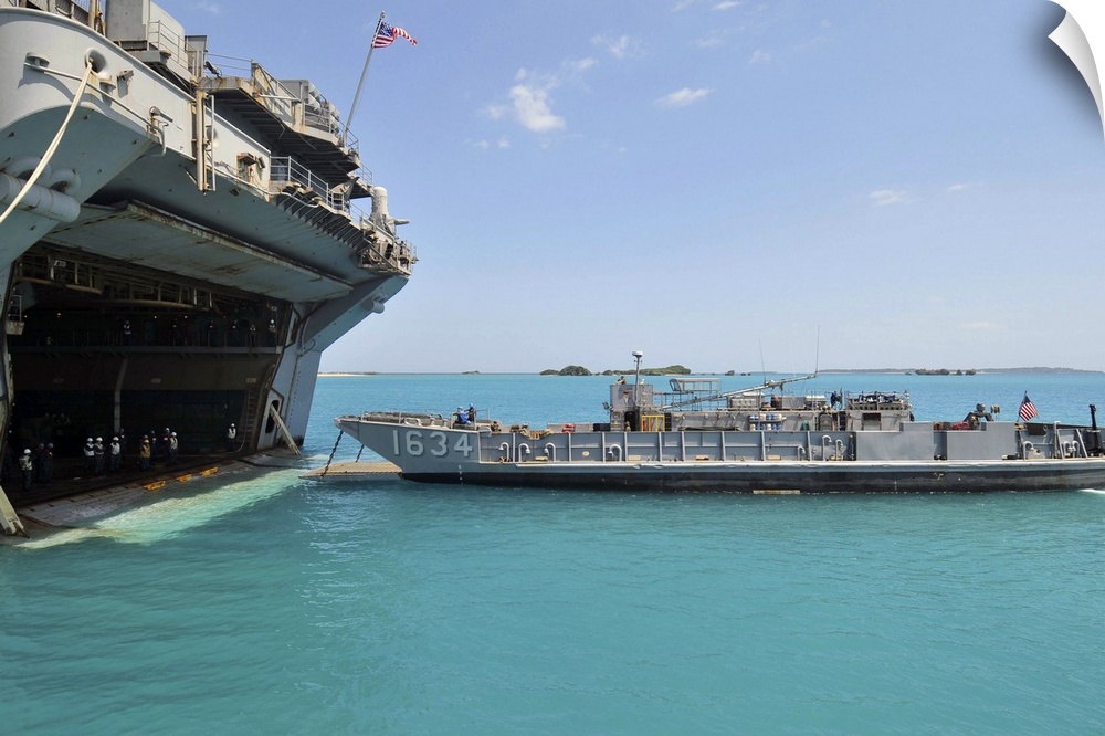 White Beach Naval Facility, Okinawa, Japan, April 12, 2011 - A landing craft utility approaches the well deck of the forwa...