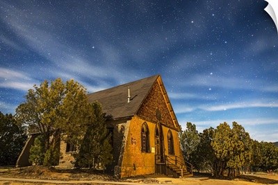 A moonlit nightscape of the historic Hearst Church in Pinos Altos, New Mexico