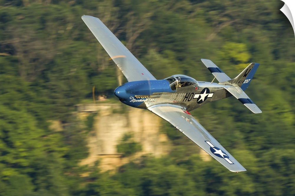 A P-51 Mustang flies along the Mississippi at Dubuque, Iowa.