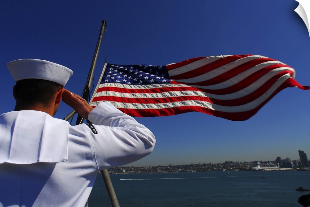 Pacific Ocean, August 28, 2007 - Aviation Boatswain's Mate (Fuel) Airman Apprentice salutes the national ensign as it is l...