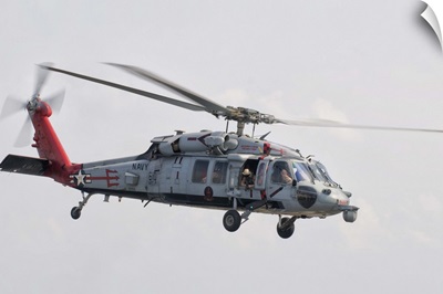 A SH-60 helicopter in flight over the Persian Gulf