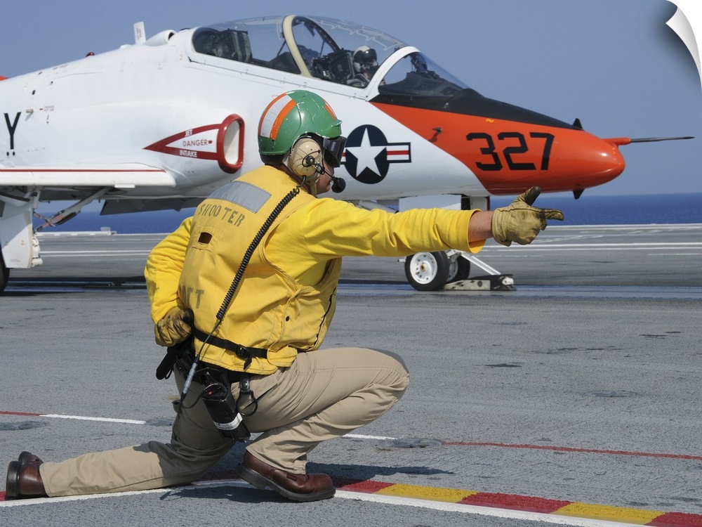 Atlantic Ocean, June 13, 2010 - A shooter launches a T-45A Goshawk assigned to Training Wing 2 from the aircraft carrier U...